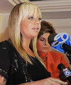 Lingerie Saleswoman Says She Was Fired For Being "Too Sexy"