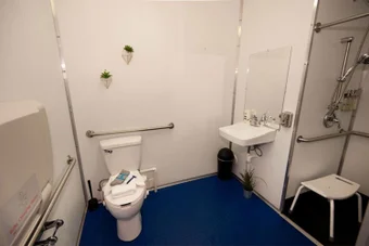 Mobile showers are stocked with hot water, towels, and products. 